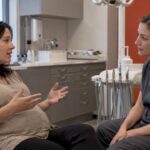 Pregnant patient discussing whitening timing with dentist